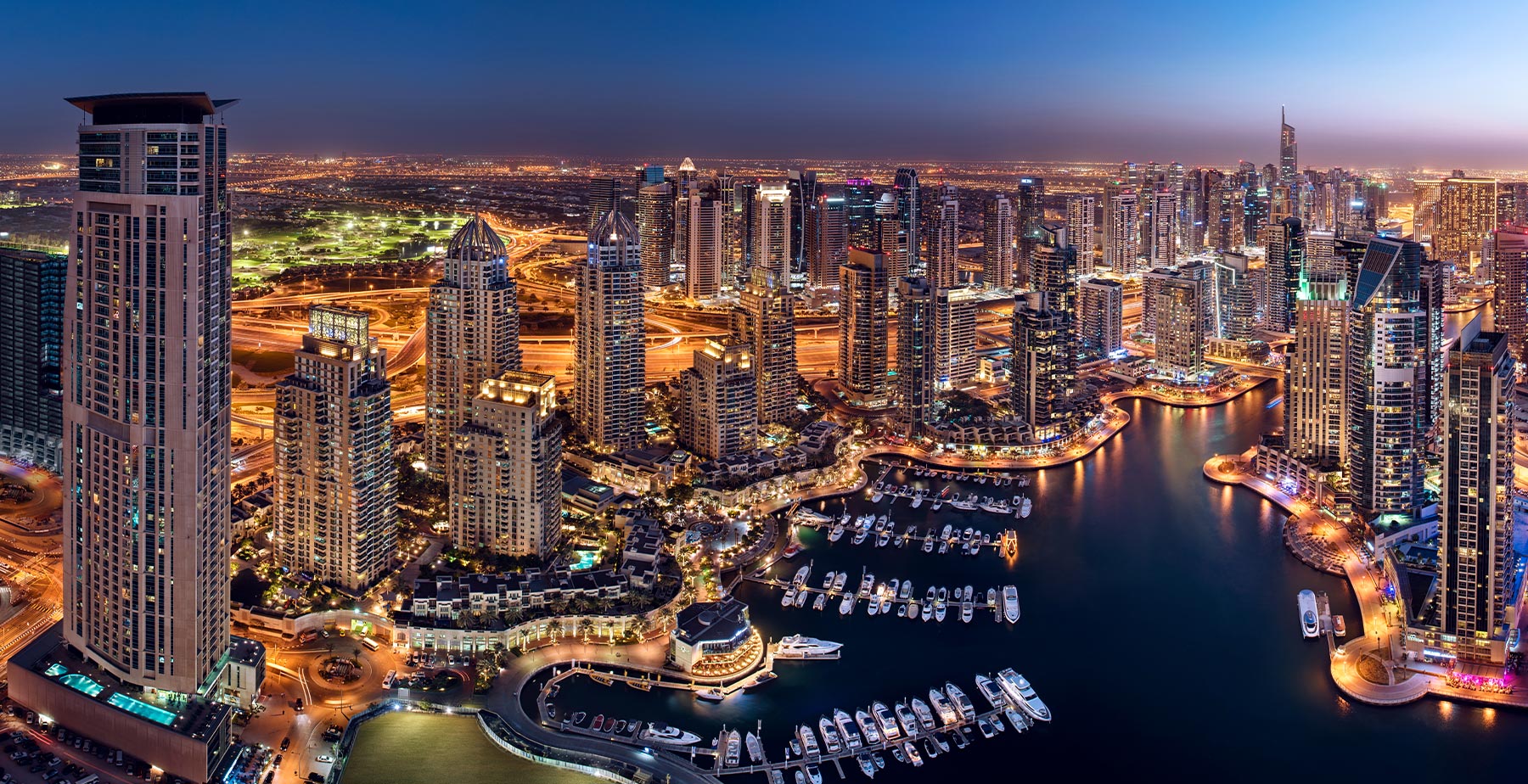 Dubai Marina waterfront photographed at blue hour